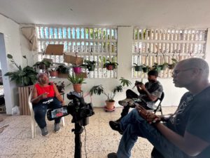 Staff recording the stories of an elder woman in Loiza as part of the Loiza Vive cultural preservation project